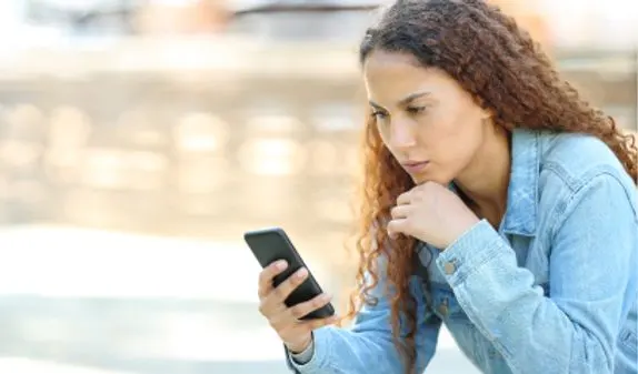 A person concentrating on their smartphone